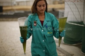 Aqualia's All-gas project researcher Laureano carries two Imhoff cones with water samples from a tank at a waste-water treatment plant in Chiclana de la Frontera